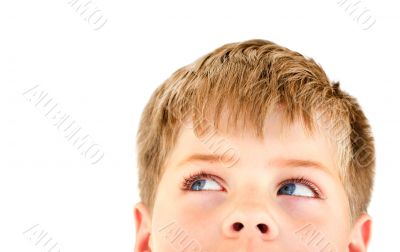 Blond boy looking into the corner. Isolated on white.