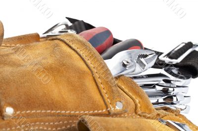 spanners in brown tool belt
