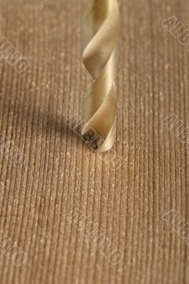 macro shot of drilling a hole in wood