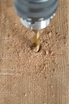 drilling a wood plank