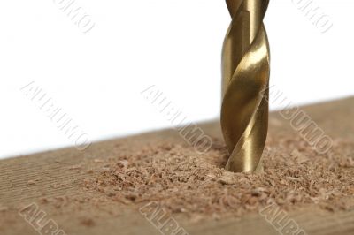 cropped image of drilling a piece of wood