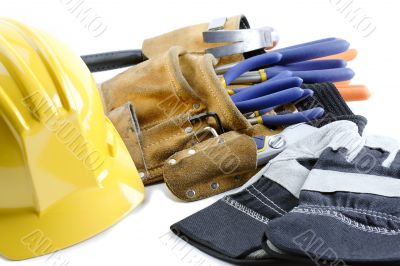 close up shot of yellow hat gloves and tool belt