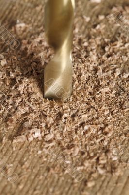 drilling a hole piece of wood plank drilling a hole piece of wood plank