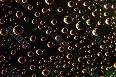 Water drops over colored background 