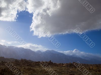 cloudy sky and rough terrain