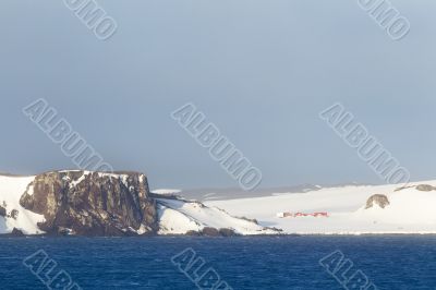 snowy cliff and sea