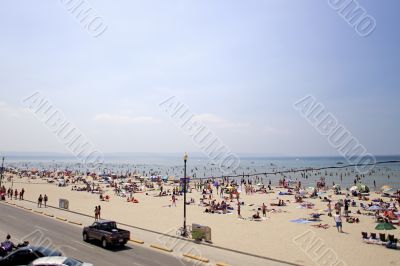 car on road with beach in background