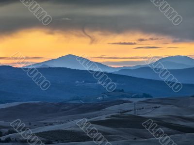 scenic sunset shot with valley and mountain range