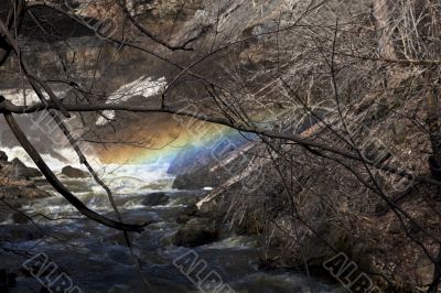 rainbow above flowing water