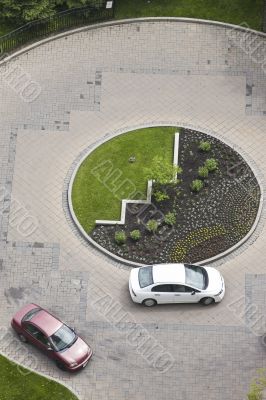 cars in a circular driveway