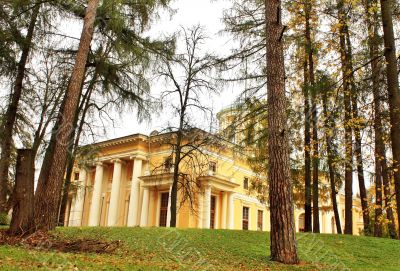Old-time estate among the autumn trees