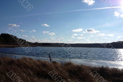 Sky with clouds and a lake.