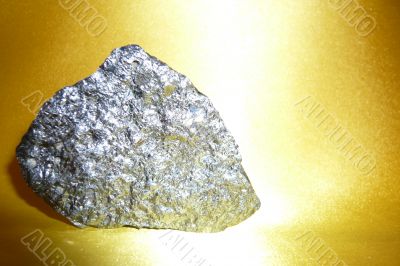 Silvery stone on a gold background. Silvery stone on a gold background.