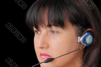 Woman in earphone with blue eyes