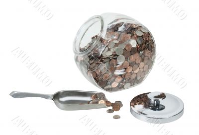 Glass Jar Full of Coins with a Metal Scoop