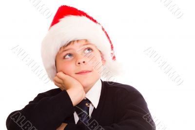 Cute schoolboy waiting for the holidays.