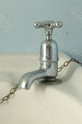 Old silver faucet