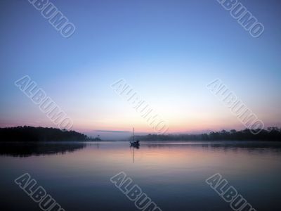 sunset with sailboat