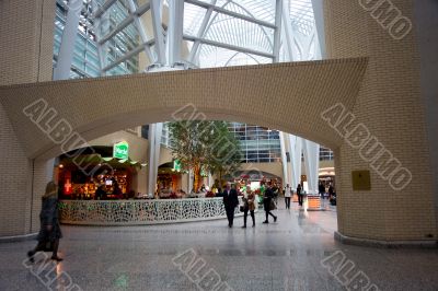 people walking at modern shopping mall