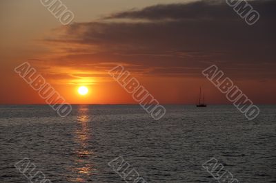 watercraft in sea at sunset