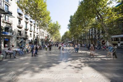 people in the streets of barcelona spain