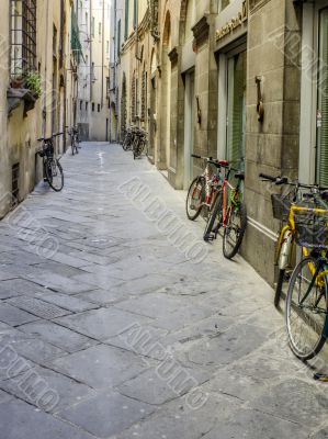 bicycles parked on the street in tuscany