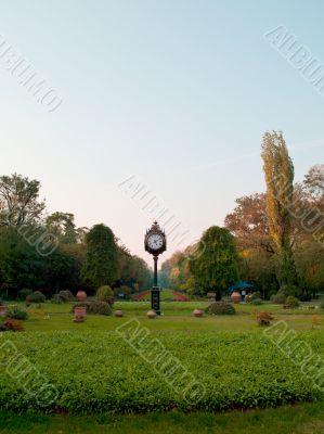 clock in gardens near the parliament buildings in bucharest romania