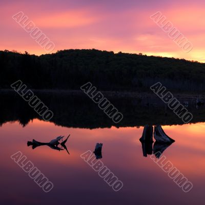 reflection of cliff on lake water