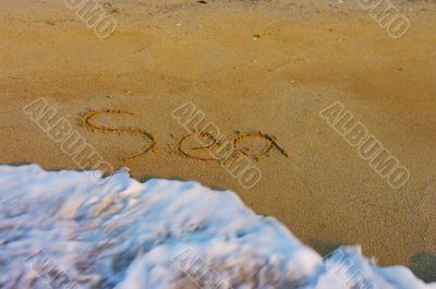 Soft wave of the sea on the sandy beach 
