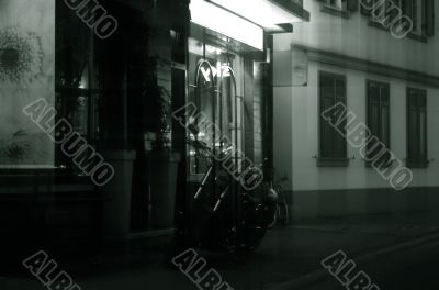 Motorcycle before a night bar Motorcycle before a night bar