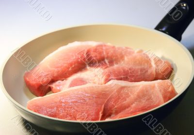  the meat in frying pans