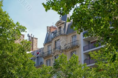 Part of a house with an attic and balcony.