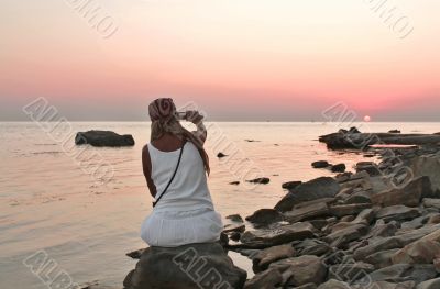 Woman on the beach at night