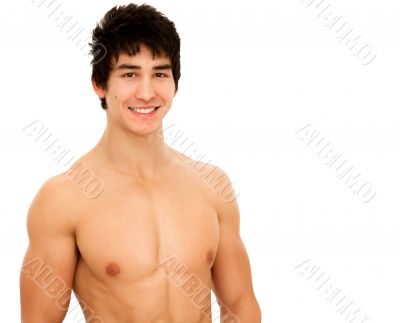 Smiling young man with muscular and tanned naked torso.