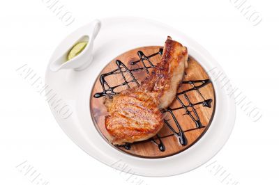 a piece of grilled meat on a wooden board 