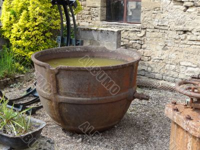 rusty metal pot in an old foundry