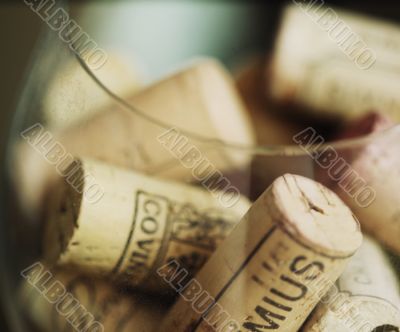 Corks from wine in a big wineglass