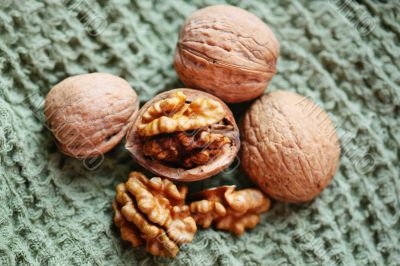 Walnuts on a green kitchen blanket