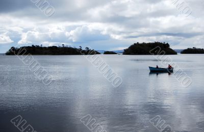 Two men in a boat in bay