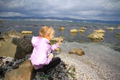 The girl looks a shell