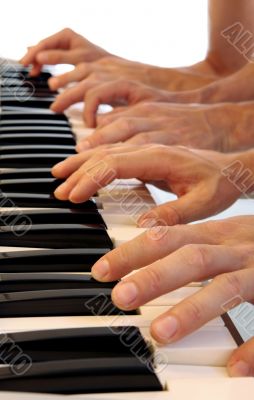 Six hands on grand piano