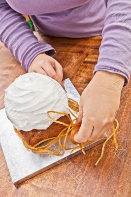 Woman decorating christmas cake Woman decorating christmas cake