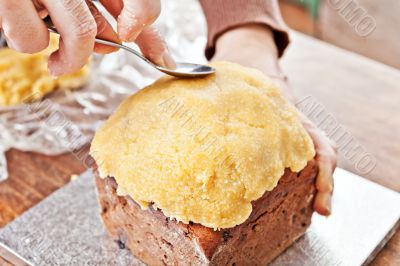 Modeling christmas cake with spoon