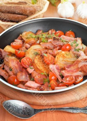 Fried potatoes with meat and vegetables