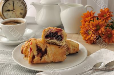 Morning cup of coffee and freshly baked cakes with cherries