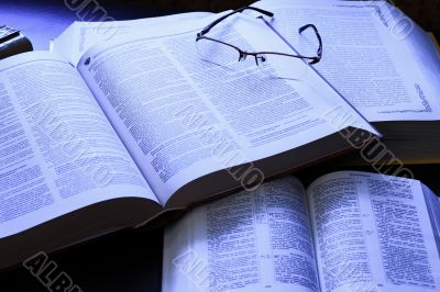 Open books are on the table. Open books are on the table.