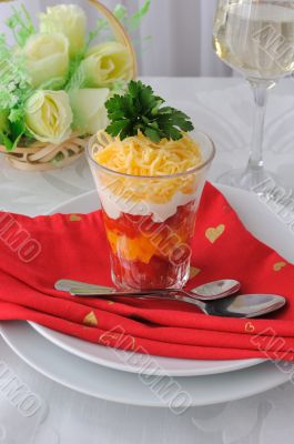 Salad of red and yellow tomatoes with mayonnaise and cheese