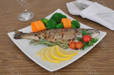 Baked sea bass with broccoli and carrots