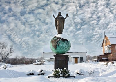 Religious sculpture - man in the mantle on the globe Religious sculpture - man in the mantle on the globe