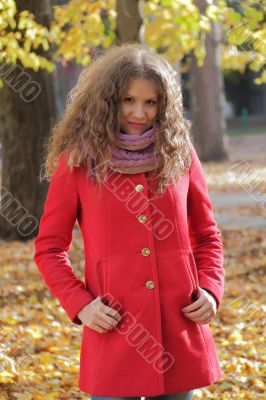 Young woman with autumn leaves